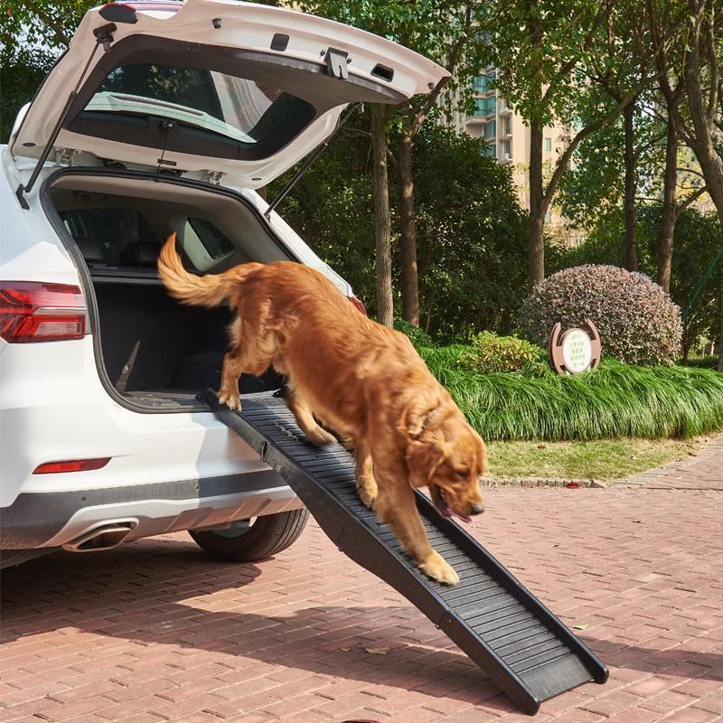 Folding pet ramp with ridged surface set against the back of an SUV