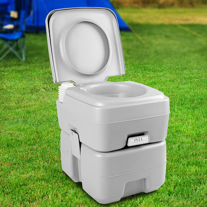 Grey portable camping toilet with flush and separate freshwater tank