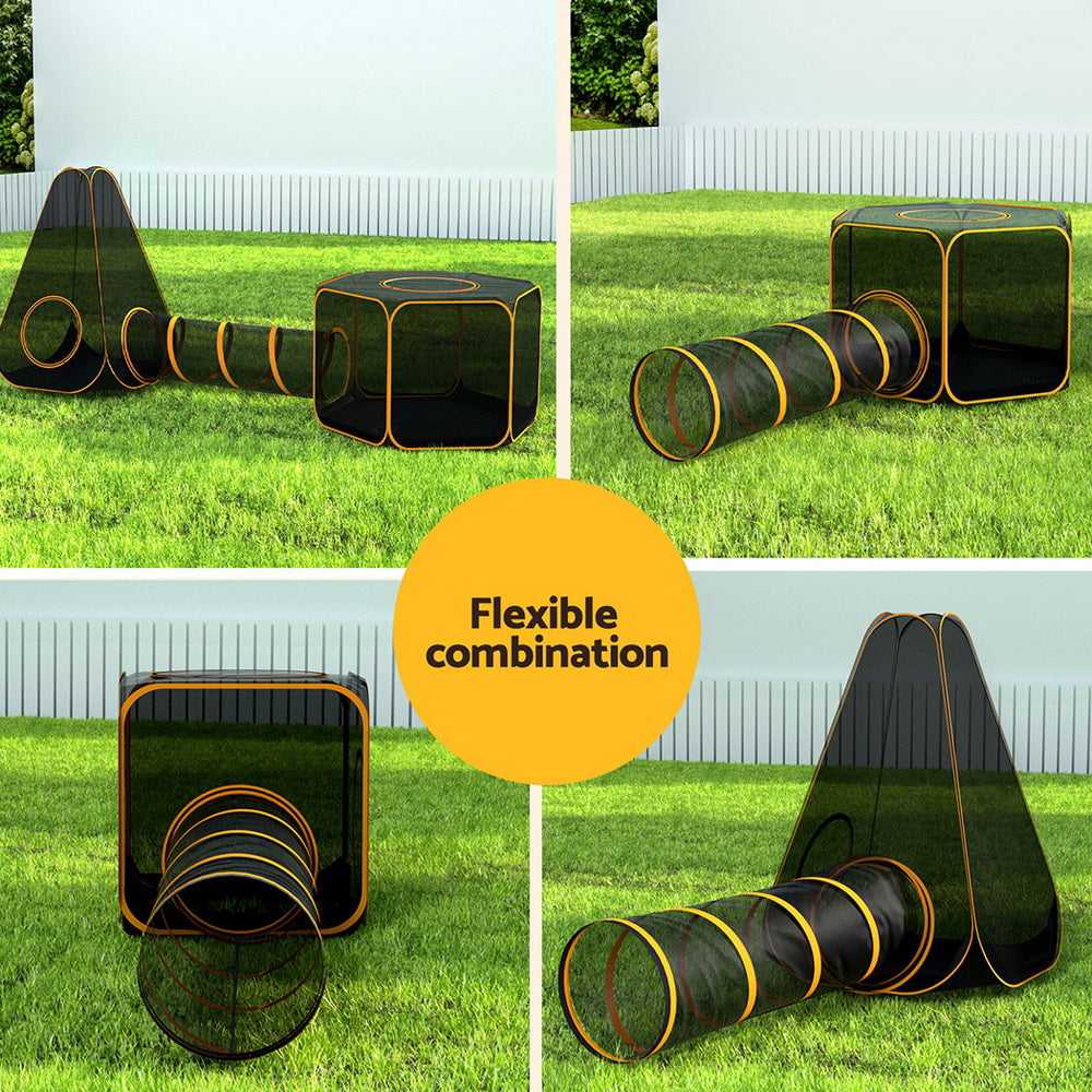 Folding six-in-one pet playpen with tunnel and mesh panels set up on grass