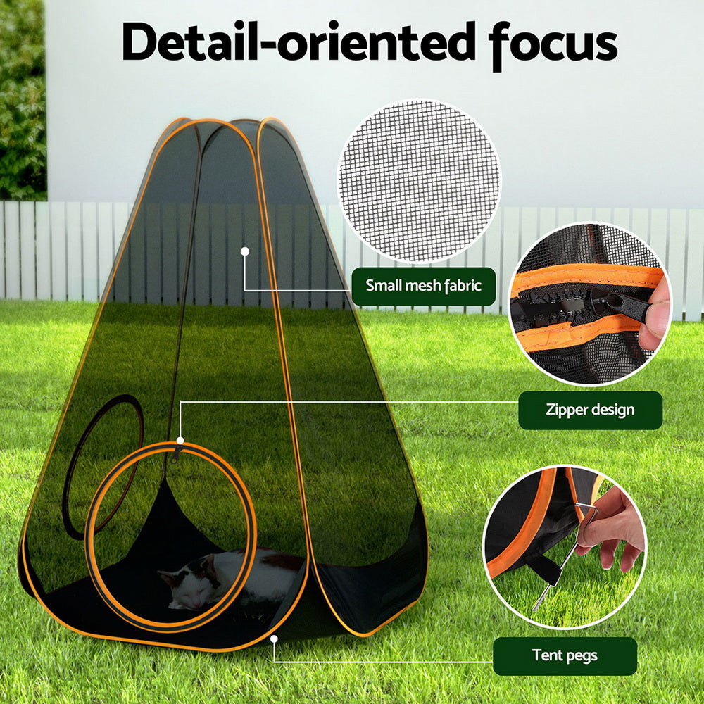 Folding six-in-one pet playpen with tunnel and mesh panels set up on grass