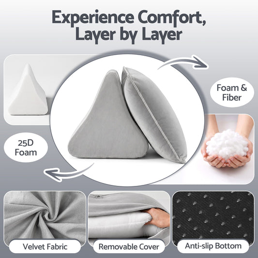 Grey velvet back support pillow with armrests propped against a bedhead