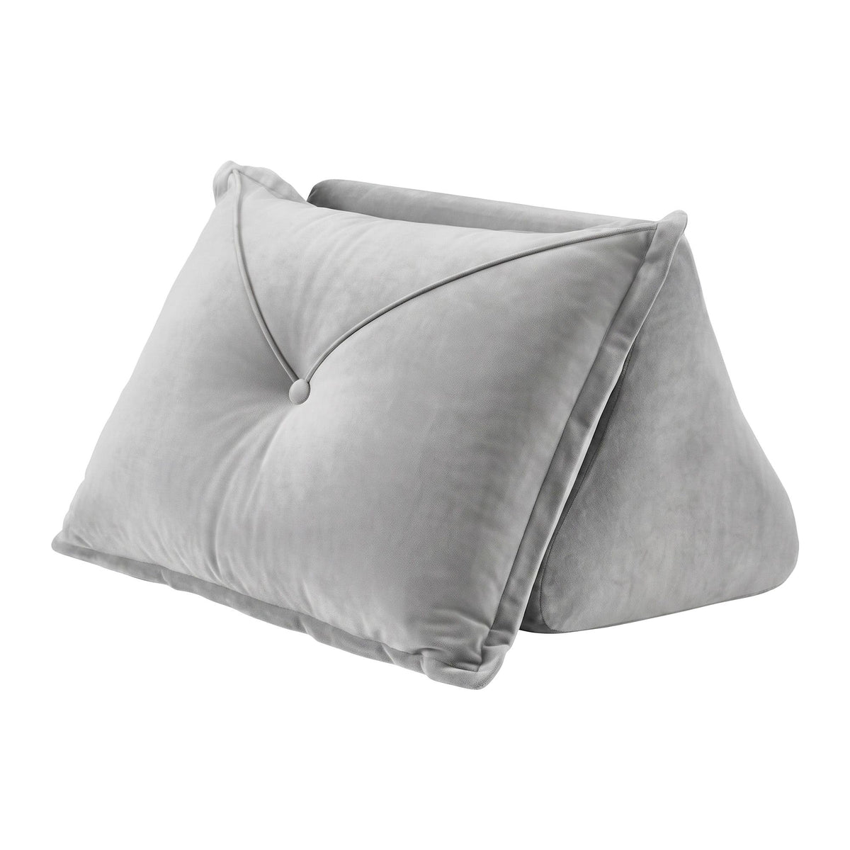 Grey velvet back support pillow with armrests propped against a bedhead