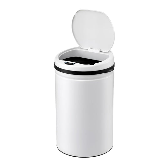 White 30 litre motion sensor kitchen bin standing beside pale cabinetry