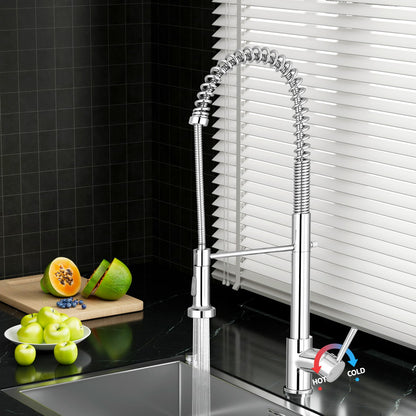 Polished chrome pull-down kitchen mixer tap over a stainless sink