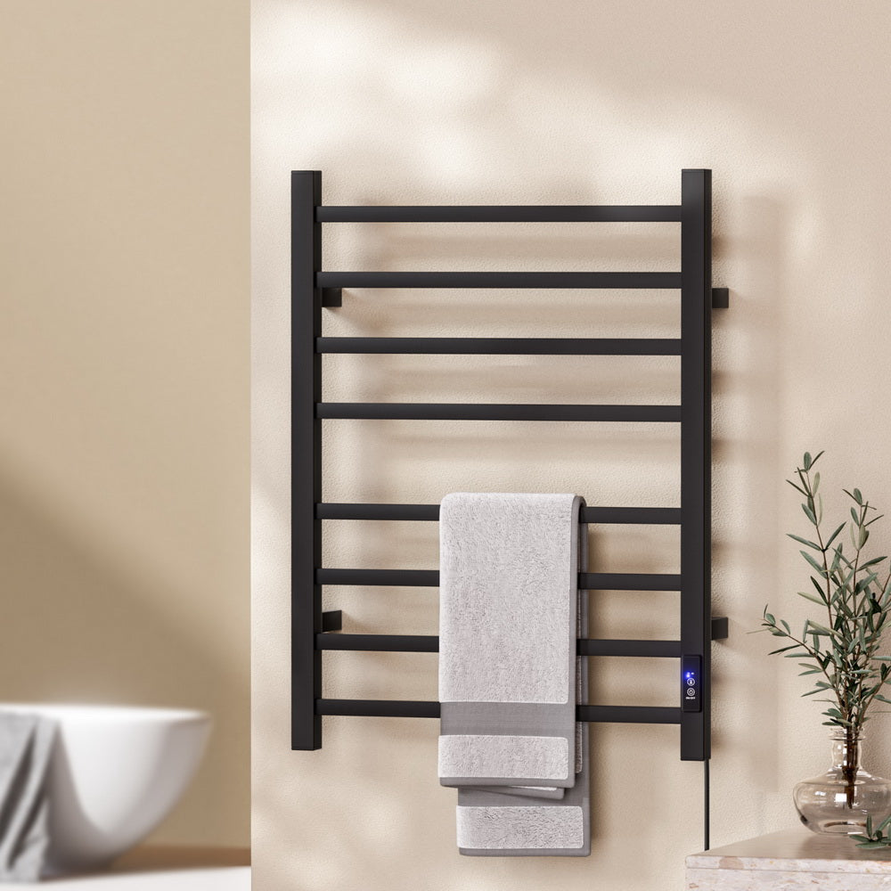 Black eight bar square profile heated towel rail mounted in a bathroom