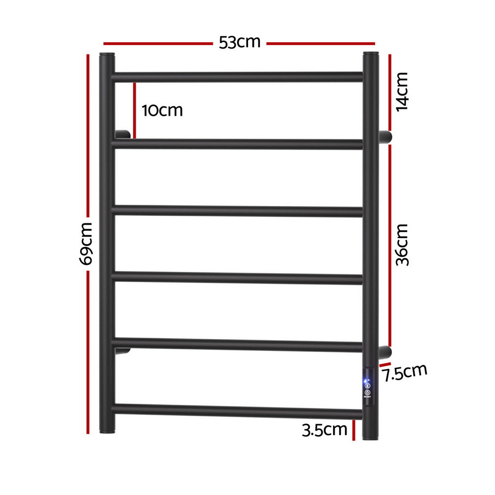 Black six bar wall mounted heated towel rail with towels hanging