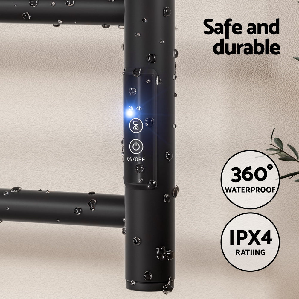 Black six bar wall mounted heated towel rail with towels hanging