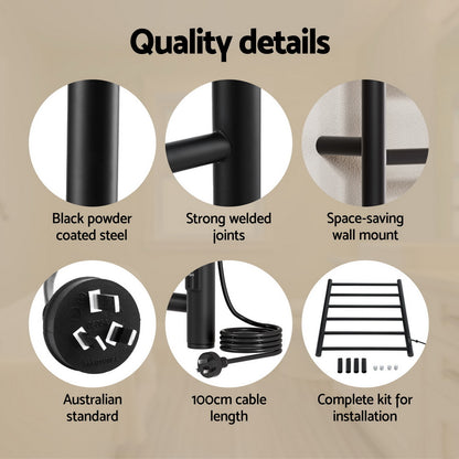 Black six bar wall mounted heated towel rail with towels hanging