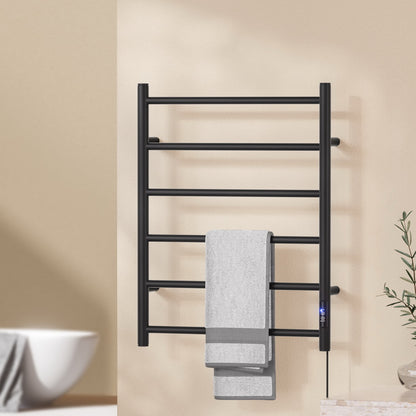 Black six bar wall mounted heated towel rail with towels hanging