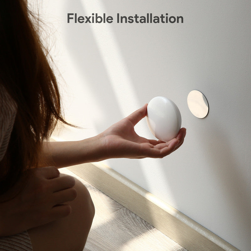 White stick-on motion sensor night light for indoor use
