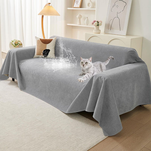 Light gray waterproof couch cover protector fitted over a three-cushion sofa