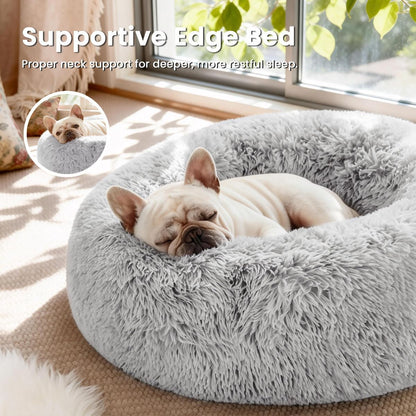 Grey round anti-anxiety donut pet bed with raised edges and plush faux fur