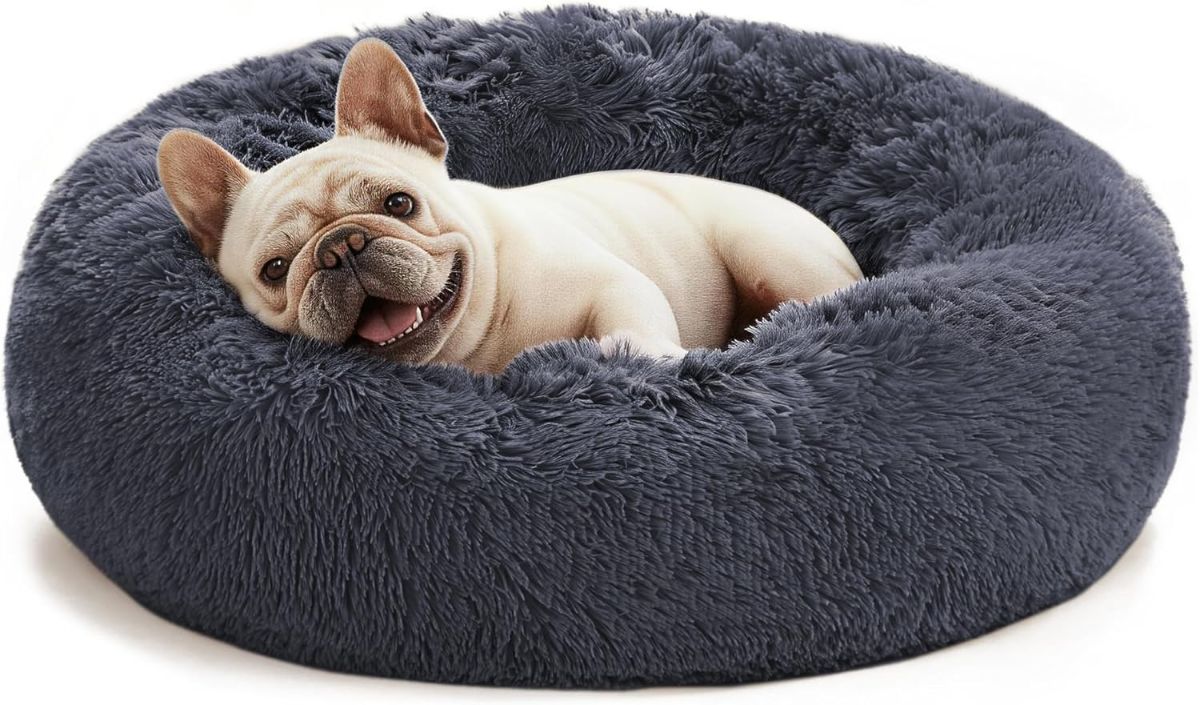Grey round anti-anxiety donut pet bed with raised edges and plush faux fur