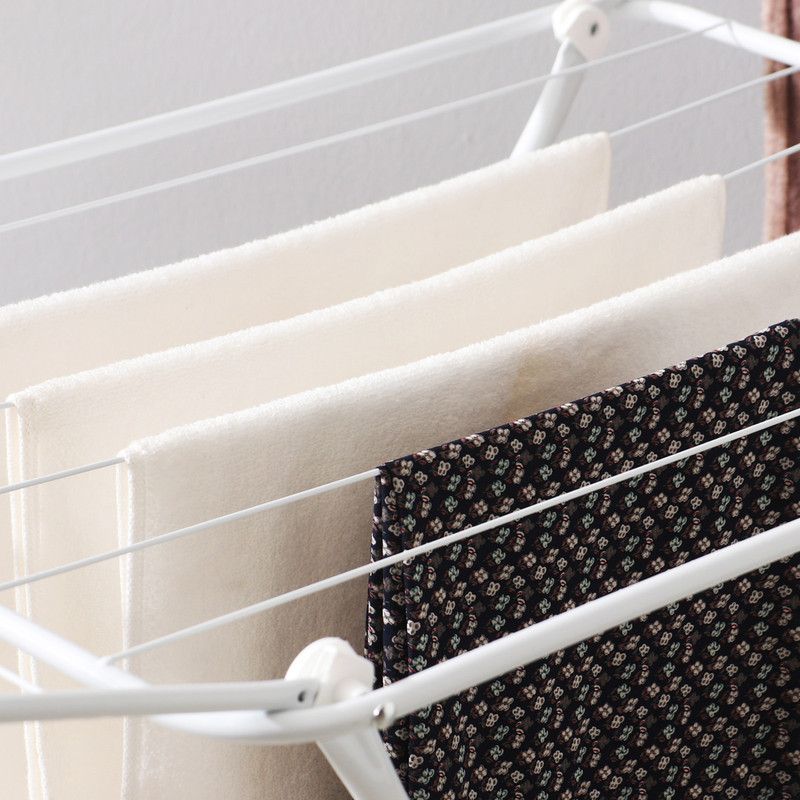 White folding clothes drying rack with double-wing sides and horizontal bars