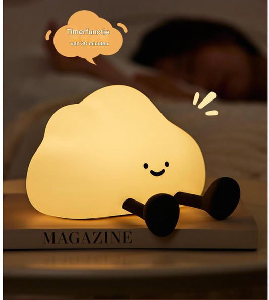Soft rubber sheep night light glowing warm white on a bedside surface