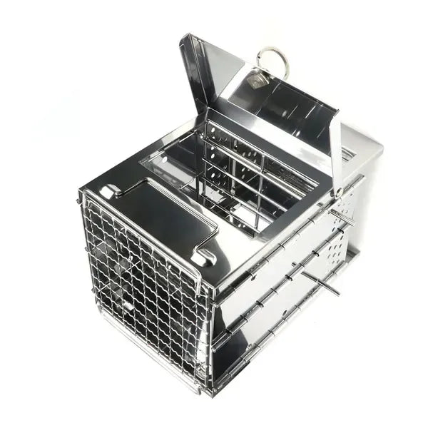 Folding stainless steel charcoal barbecue grill set up for cooking outdoors