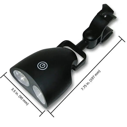 Black clip-on LED grill light clamped to a barbecue handle at night