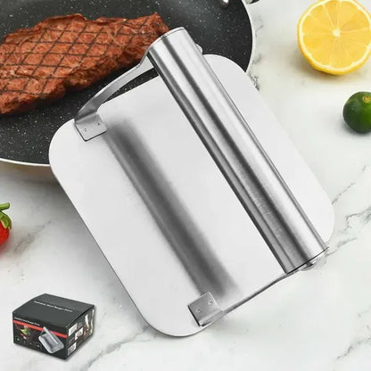 Square stainless steel burger press with round handle on a hot flat top