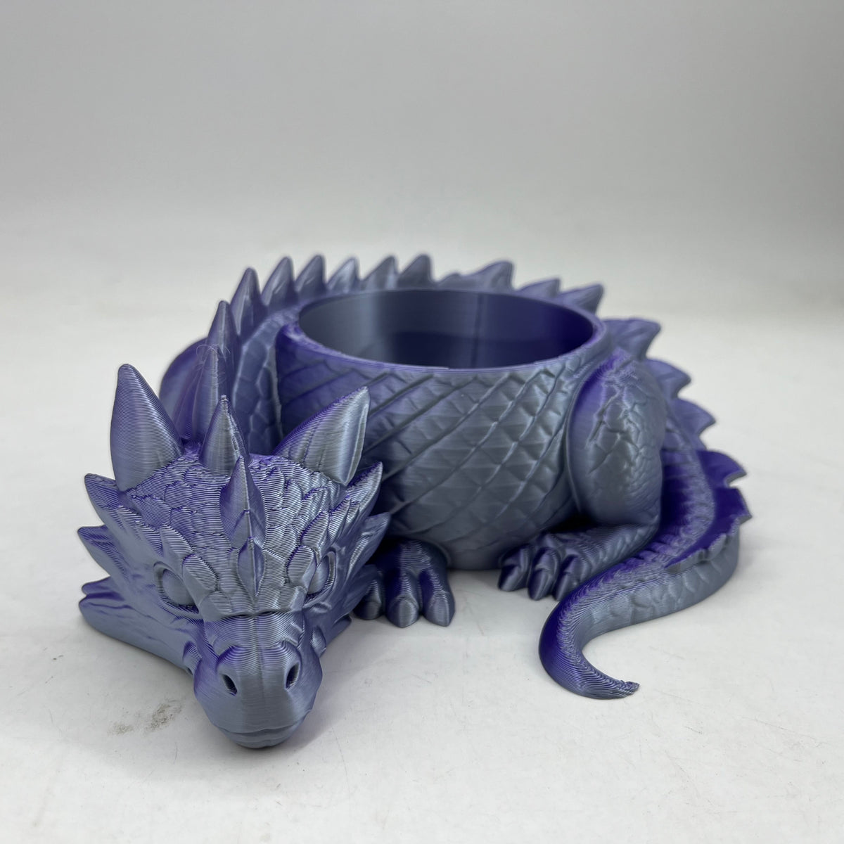 3D printed sleeping dragon sculpture forming an open bowl