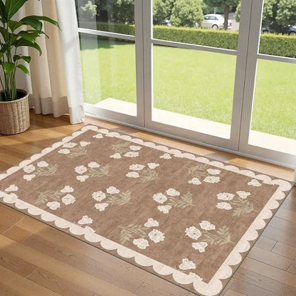 Beige and taupe floral patterned rectangular door mat with scalloped border