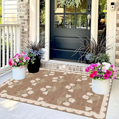 Beige and taupe floral patterned rectangular door mat with scalloped border