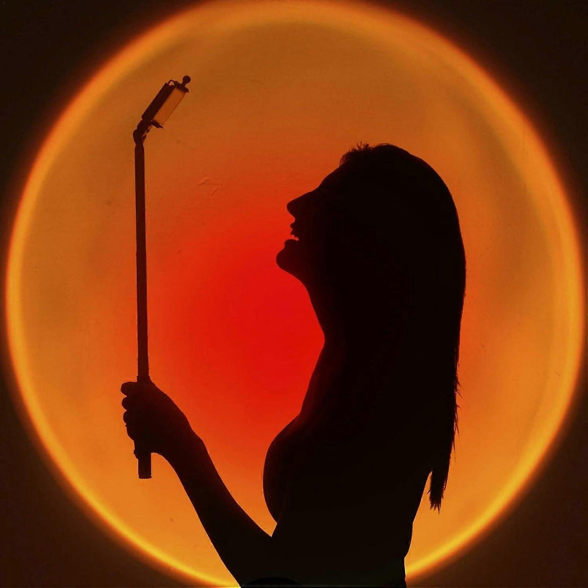 Rainbow sunset projection floor lamp with black base and 180-degree rotating head