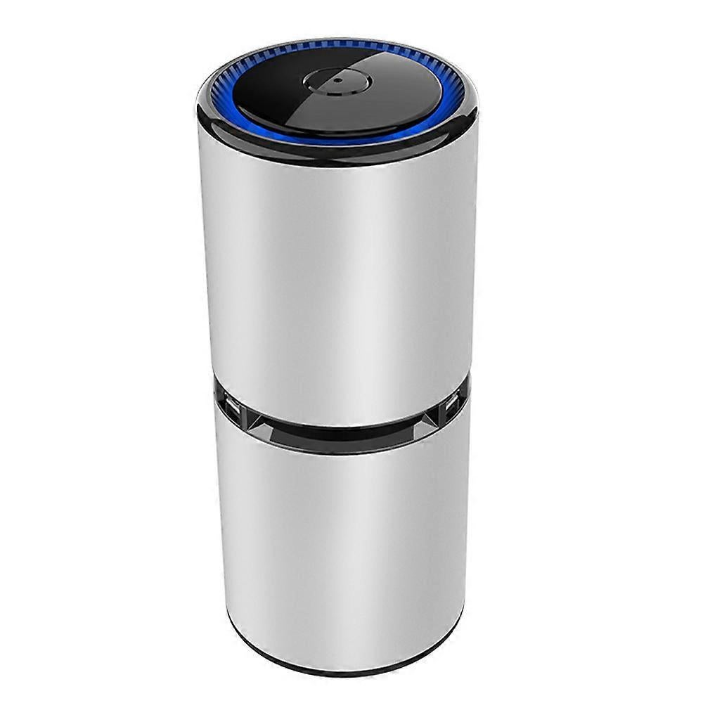 Compact portable air purifier standing on a bedside table
