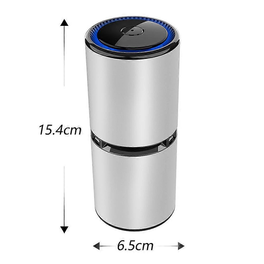 Compact portable air purifier standing on a bedside table