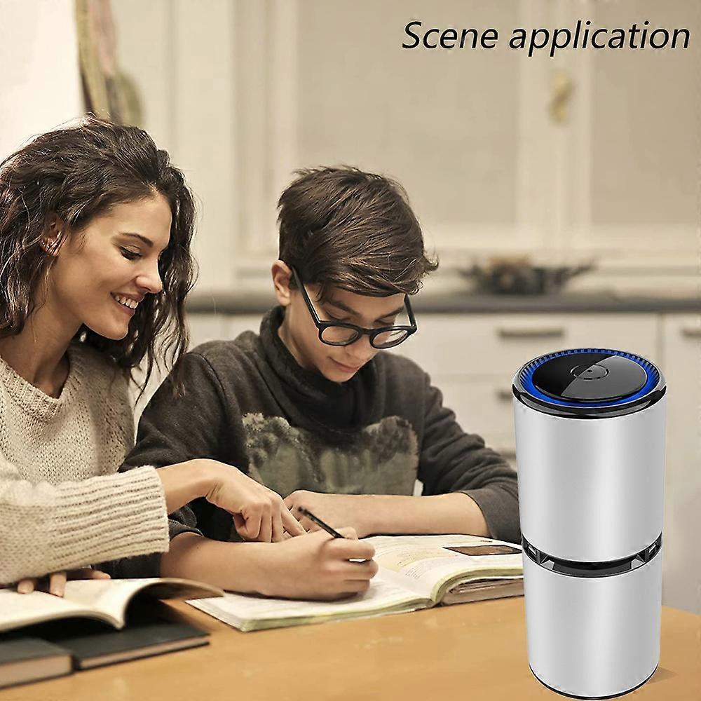 Compact portable air purifier standing on a bedside table