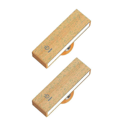 Pair of timber battery wall sconces mounted on a wall and lit warm white