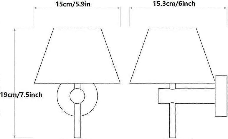 Pair of chrome wall sconces with white linen shades lit on a bedroom wall