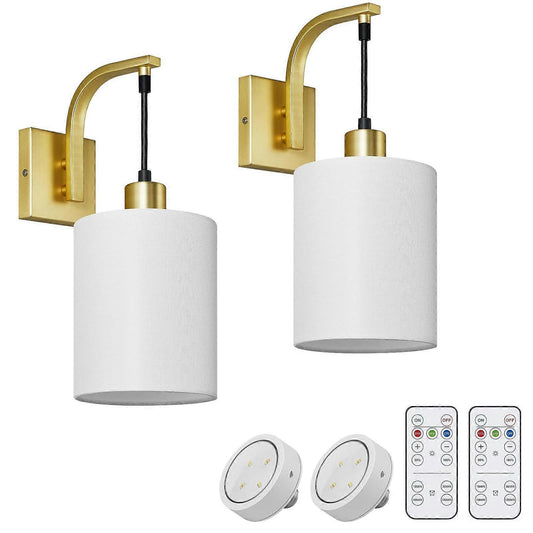 Set of two gold battery operated wall sconces with white linen shades and remote control