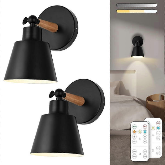 Pair of battery operated wall sconces lit on a wall with a remote control
