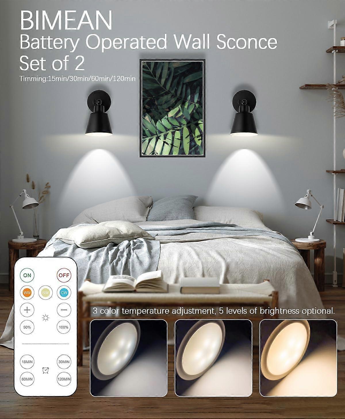 Pair of battery operated wall sconces lit on a wall with a remote control