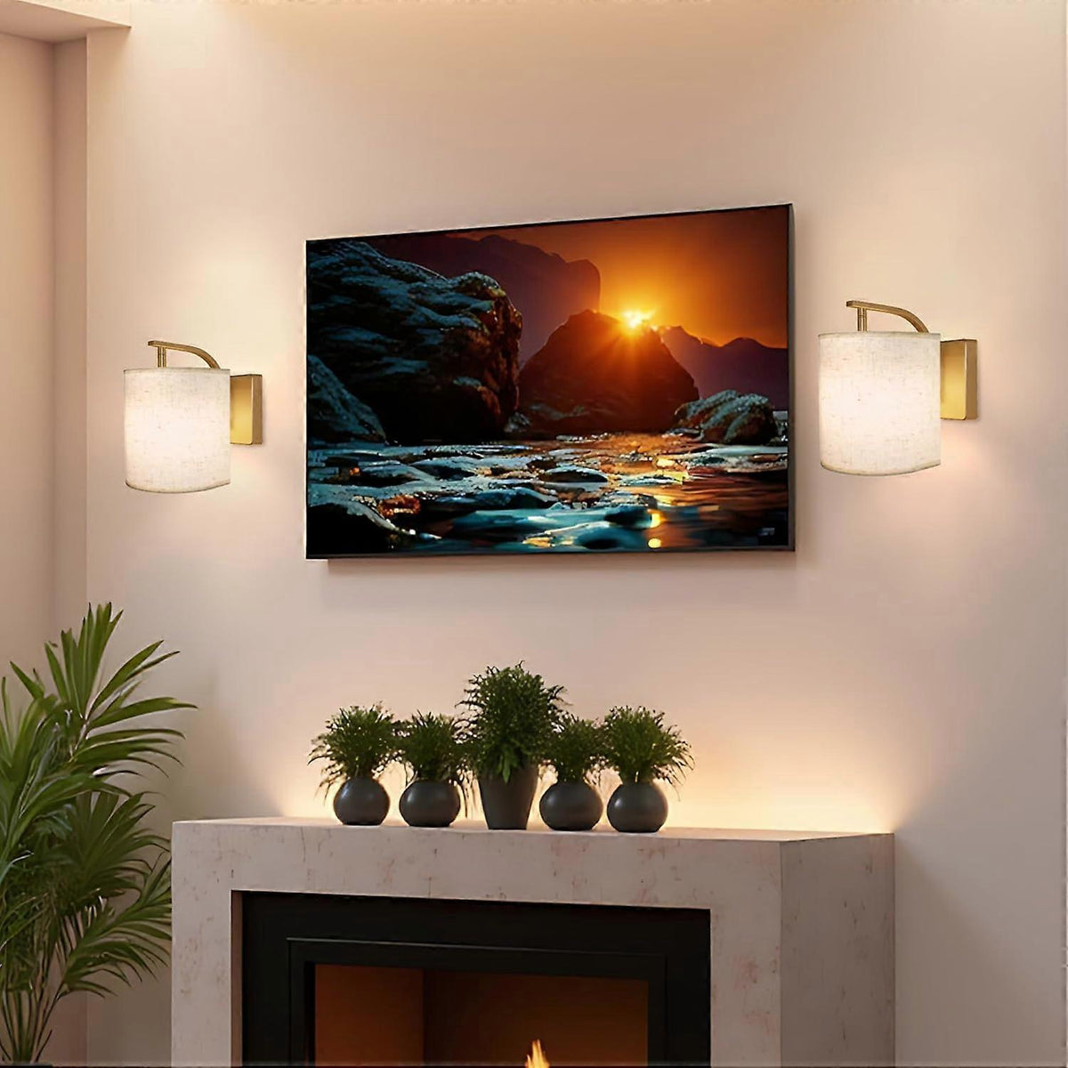 Pair of gold rechargeable wall sconces lit in colour on a wall