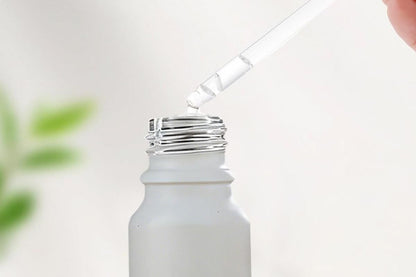 Pack of 10 matte white glass dropper bottles with rose gold caps