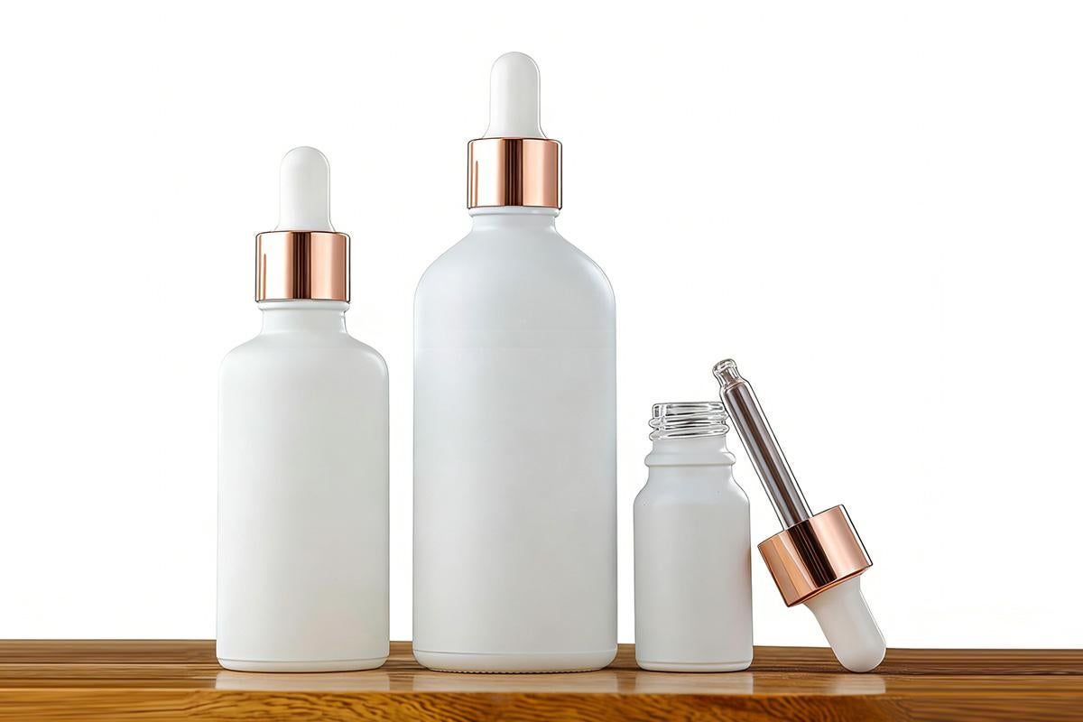 Pack of 10 matte white glass dropper bottles with rose gold caps