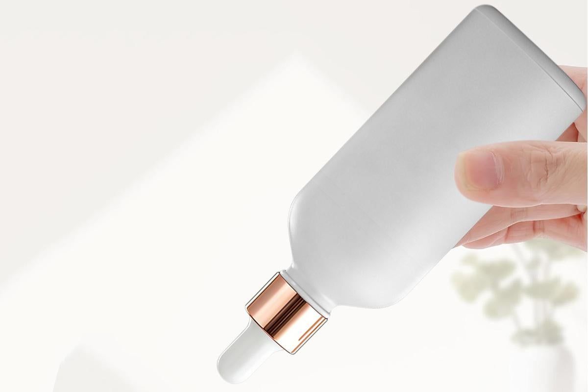 Pack of 10 matte white glass dropper bottles with rose gold caps