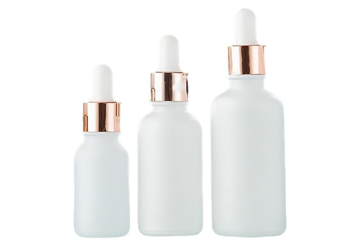Pack of 10 matte white glass dropper bottles with rose gold caps