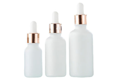 Pack of 10 matte white glass dropper bottles with rose gold caps