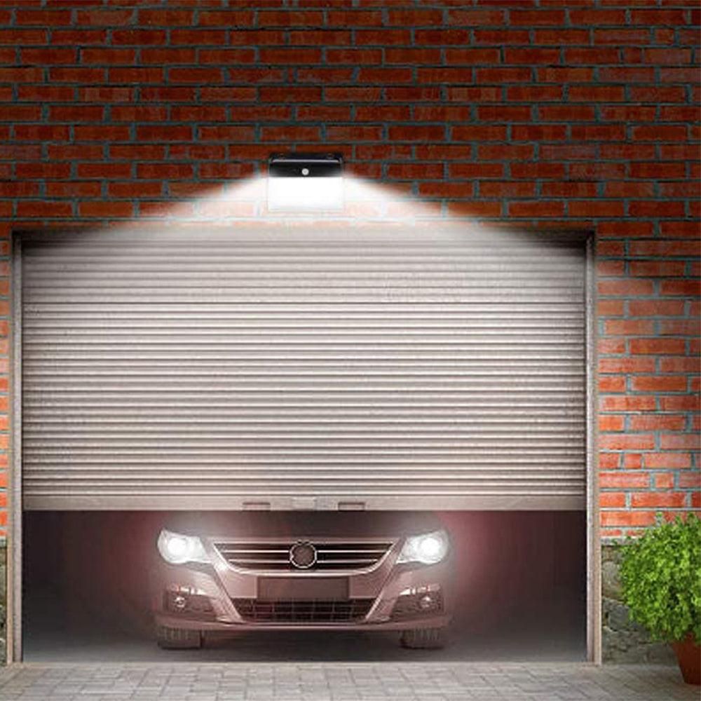 Black solar wall light with motion sensor and LED panel for outdoor use