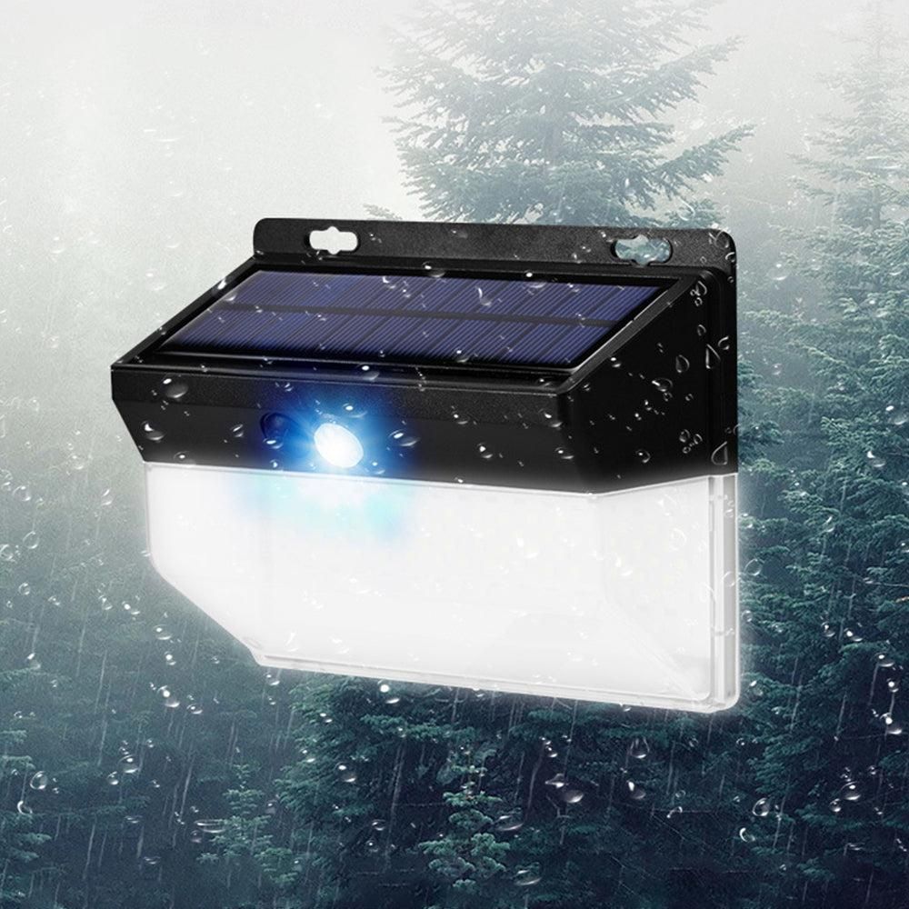 Black solar wall light with motion sensor and LED panel for outdoor use