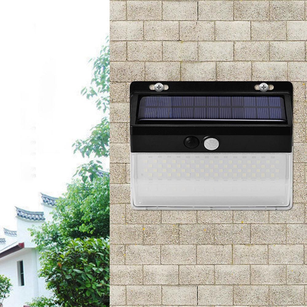 Black solar wall light with motion sensor and LED panel for outdoor use
