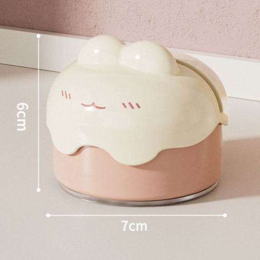 Pink suction cup knife sharpener locked to a kitchen benchtop