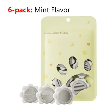 Grey sunflower-shaped deodoriser discs with adhesive backing