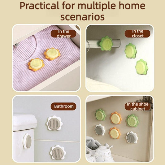 Grey sunflower-shaped deodoriser discs with adhesive backing