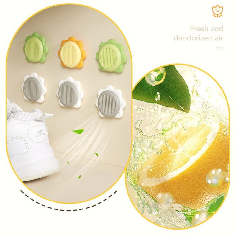 Grey sunflower-shaped deodoriser discs with adhesive backing