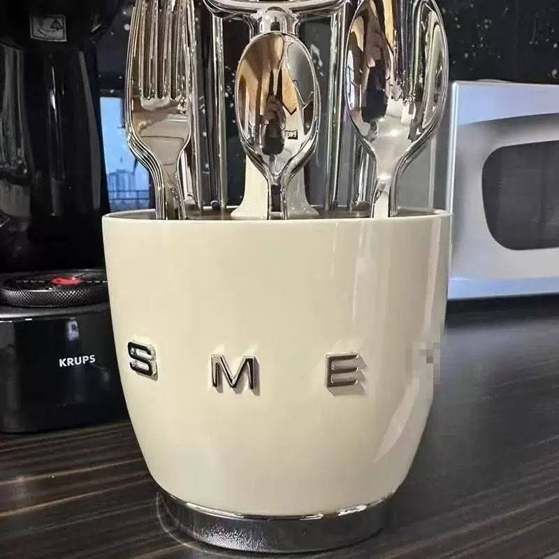 Beige cutlery caddy with compartments, pull-up handle and non-slip base on a kitchen counter
