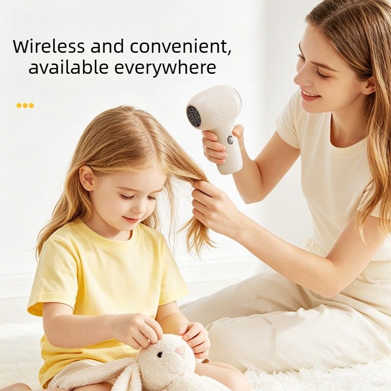 Beige cordless baby hair dryer with ergonomic handle and compact body