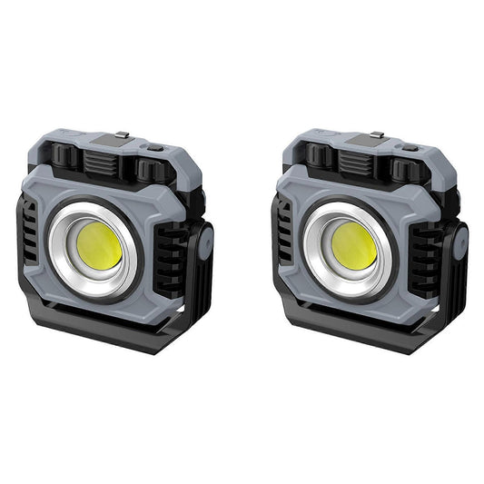 Two grey and black rechargeable camping lights with USB cables and hanging options